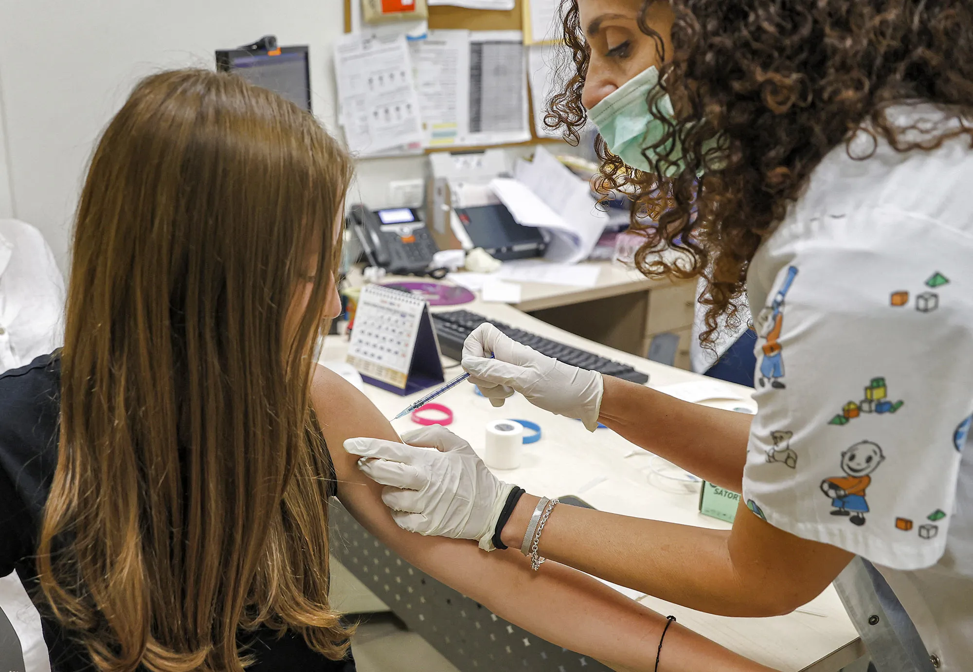 A teenage girl receives a dose of the Pfizer-BioNTech Covid-19 vaccine in&nbsp;Holon, Israel on June 21.