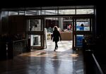 A shopper walks out of a store at the Southland Center shopping mall in Taylor, Michigan.