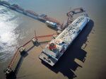RUDONG, CHINA - JANUARY 15: Australian liquefied natural gas (LNG) tanker 'Southern Cross' sits docked at the LNG terminal of Yangkou port on January 15, 2018 in Rudong County, China. The LNG terminal belongs to China National Petroleum Corporation (CNPC), and it was put into operation in May, 2011. (Photo by VCG/VCG via Getty Images)