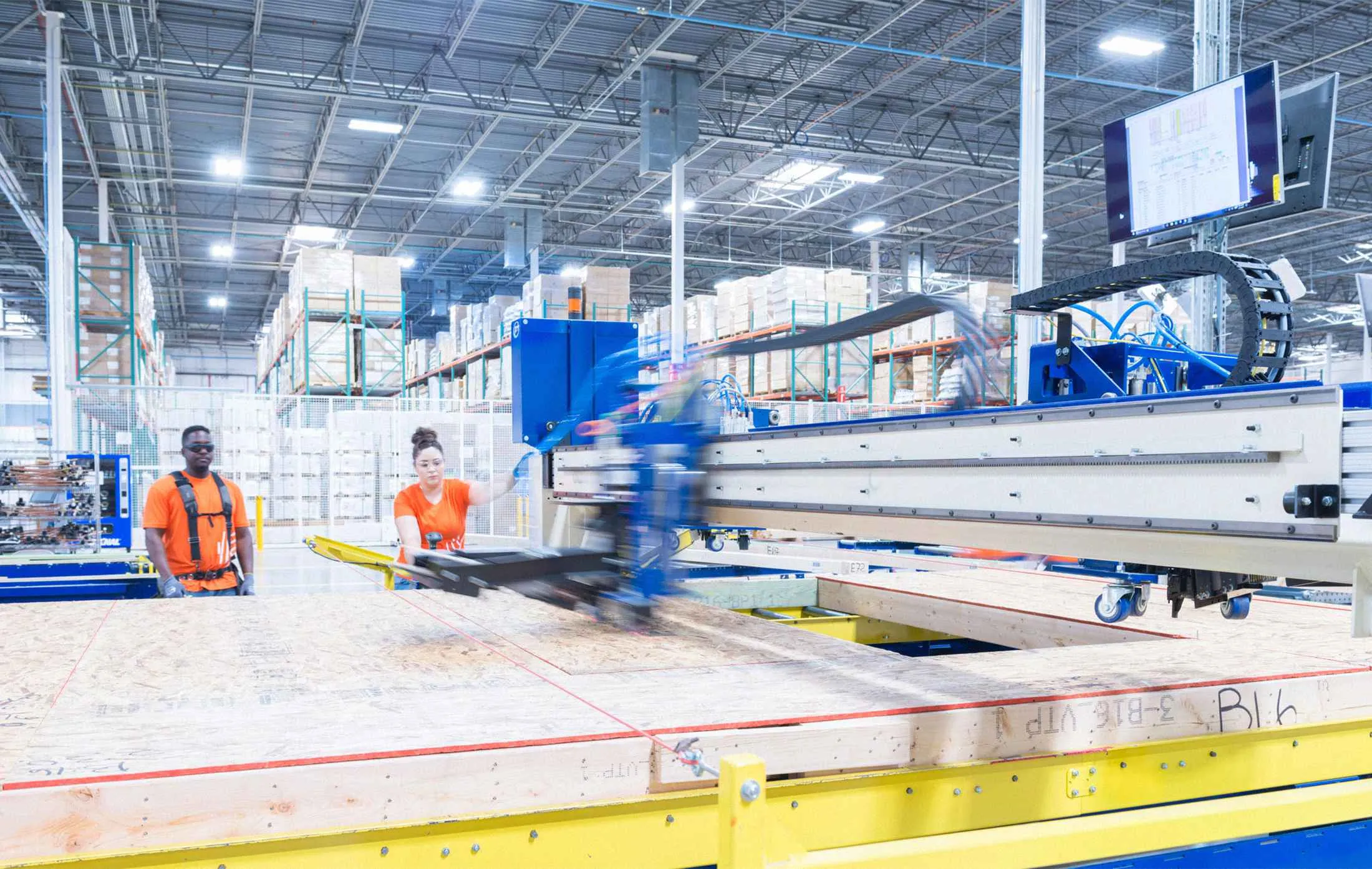 At a factory in Phoenix, Katerra staffers and robots build prefab wall panels on an assembly line.&nbsp;