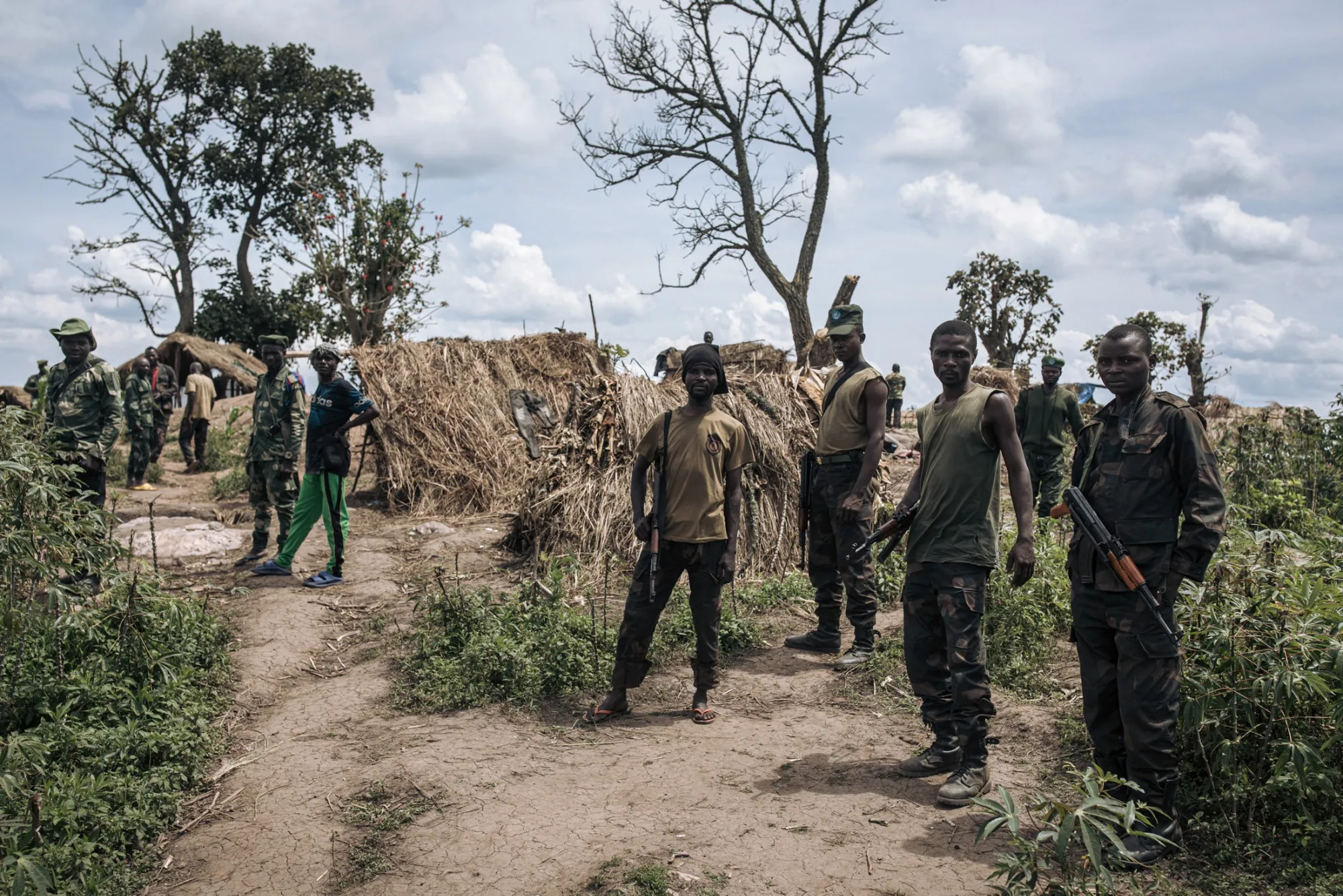 Milita and DRC soldiers at a front line position near town controlled by M23 rebels, eastern Democratic Republic of Congo, in May.