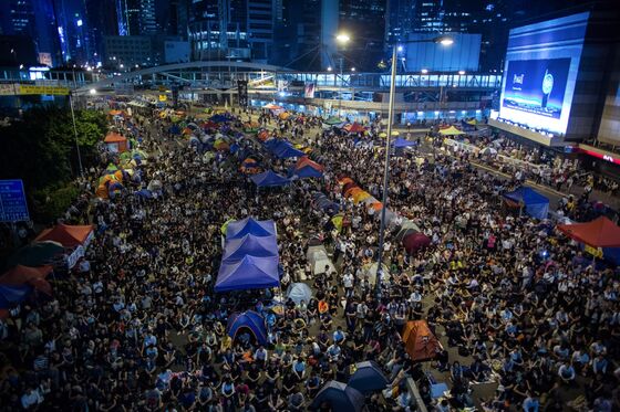 Stay or Move to U.K.? Hong Kong Locals Face Hard Choice as China Reshapes City