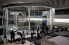 Members of the media gather inside the Tokyo Stock Exchange (TSE), operated by Japan Exchange Group Inc. (JPX), in Tokyo, Japan, on Thursday, Oct. 1, 2020.