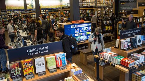 Customers shop inside Amazon Books in Seattle, Washington, on Nov. 3, 2015.