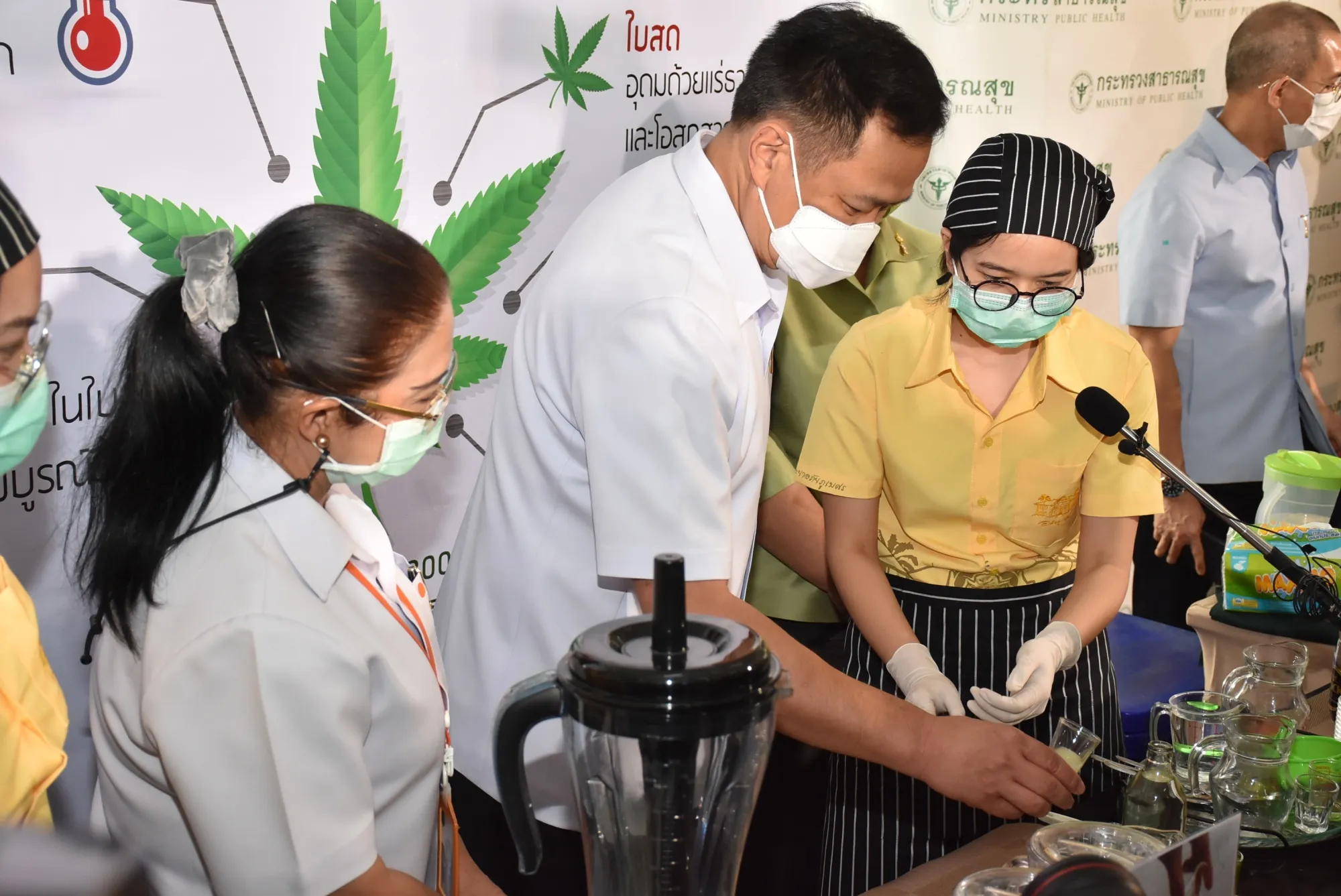 Anutin Charnvirakul mixes marijuana drinks at a event to showcase cannabis products in Thailand.