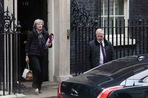 Theresa May leaves for Parliament, Jan. 25.