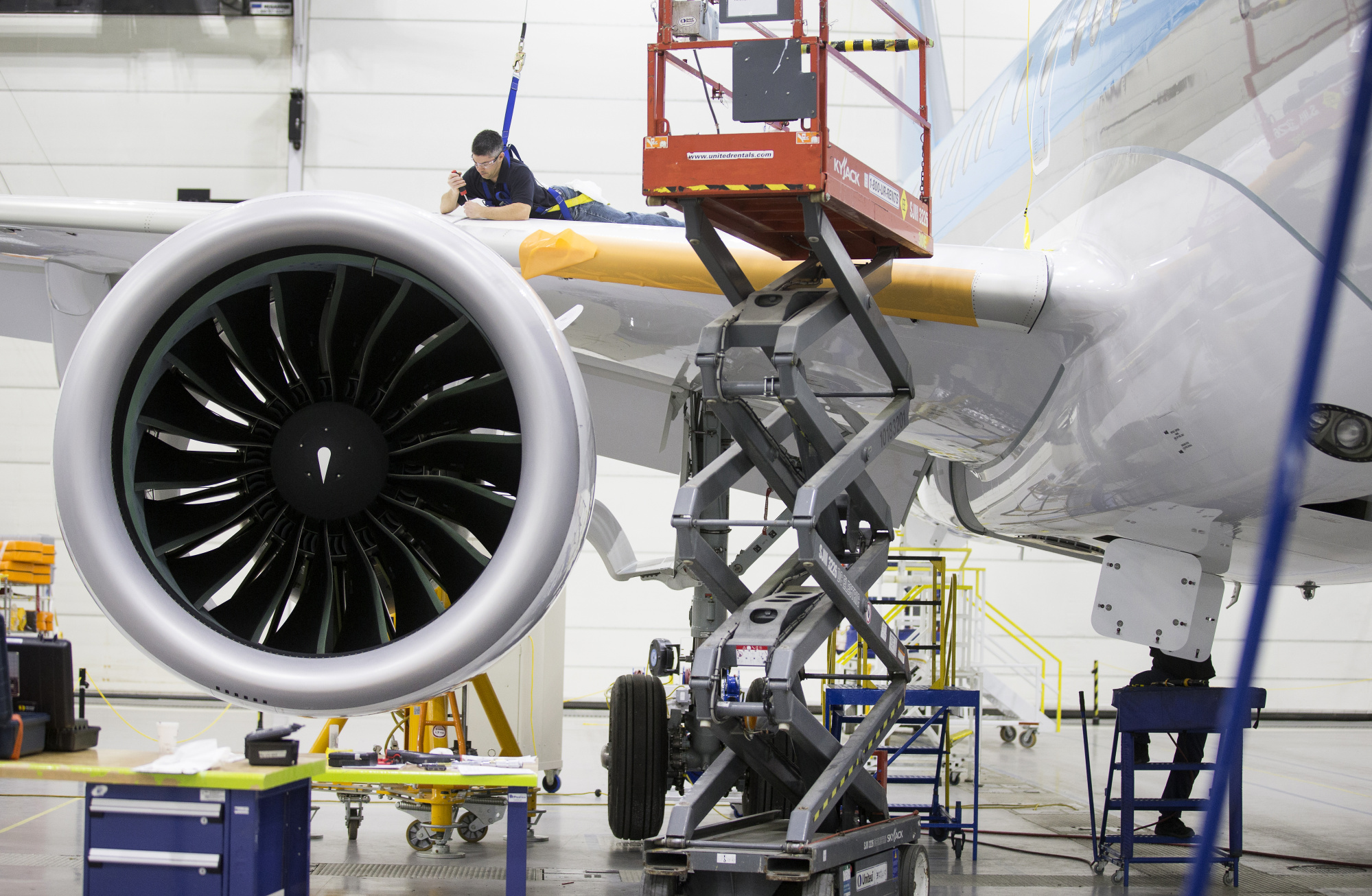 An employee works on the wing of a Bombardier Inc. CS300 airplane at the company's hangar in Mirabel, Quebec, Canada, on&nbsp;Dec. 22.&nbsp;