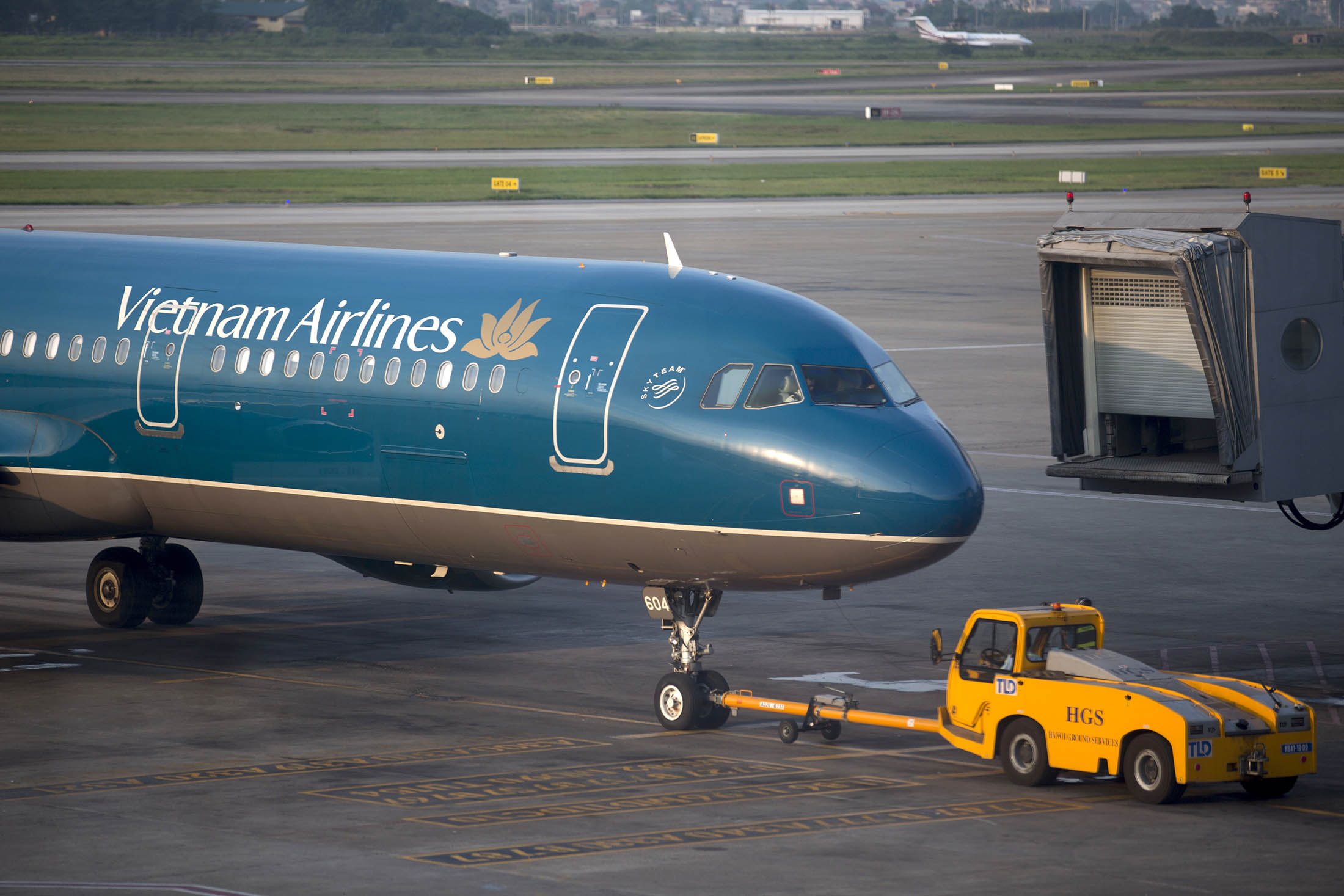 A Vietnam Airlines aircraft is towed at Noi Bai International Airport in Hanoi.
