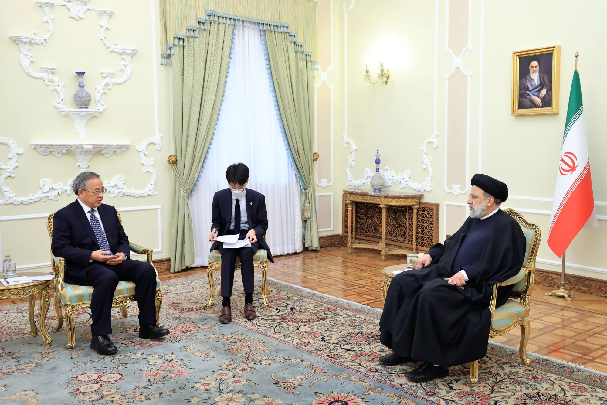 Hu Chunhua with Ebrahim Raisi in Tehran, on Dec. 13.