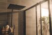 Close up of Water flowing from shower in the bathroom interior