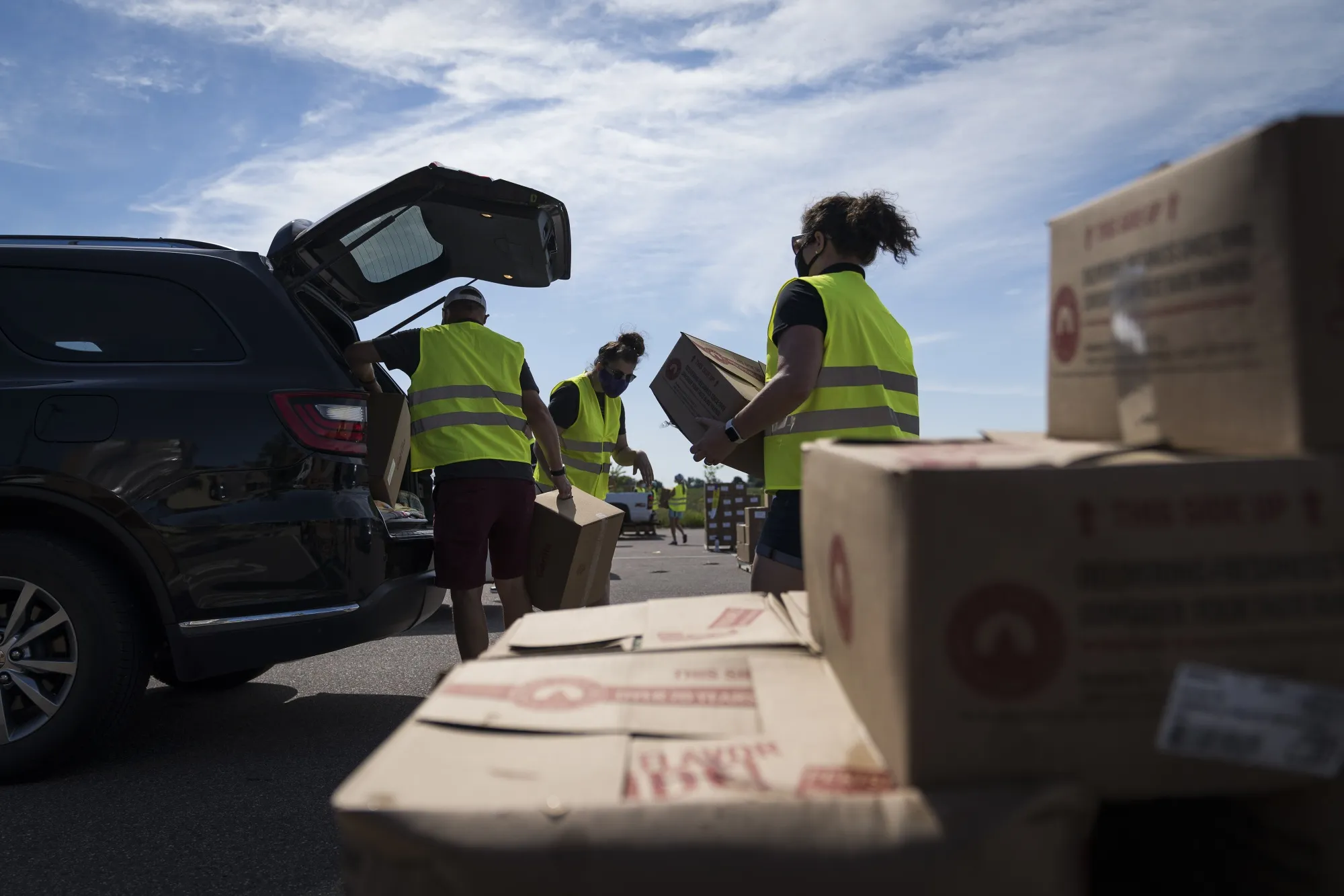 Volunteers distribute food items at a pop-up grocery event in Mankato, Minnesota, in&nbsp;July 23, 2020.&nbsp;