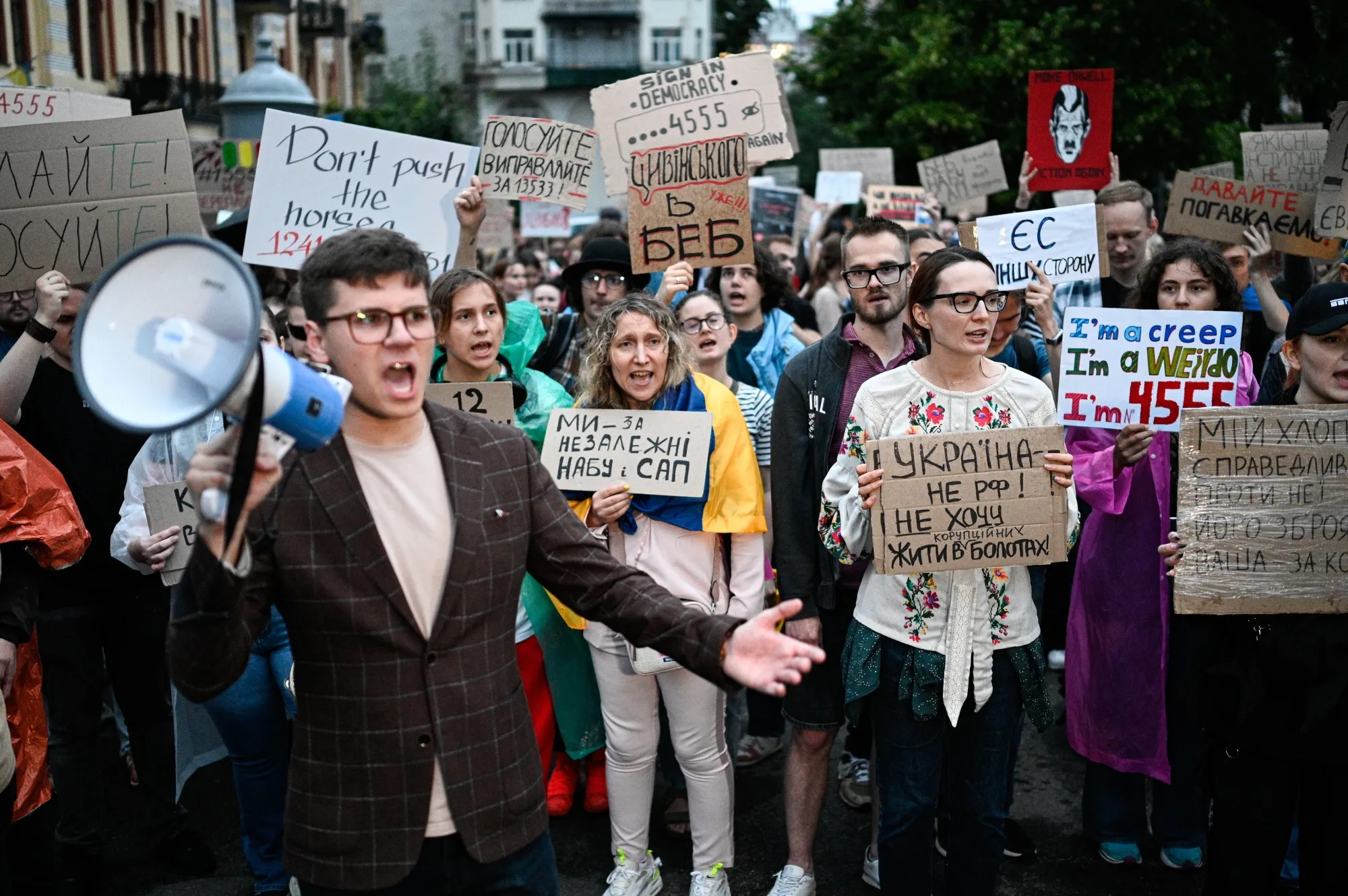 Protestors demonstrate against the implementation of the draft law, which regulates the work of the Special Anti-Corruption Prosecutor's Office and the National Anti-Corruption Bureau, in Kyiv, on July 30.