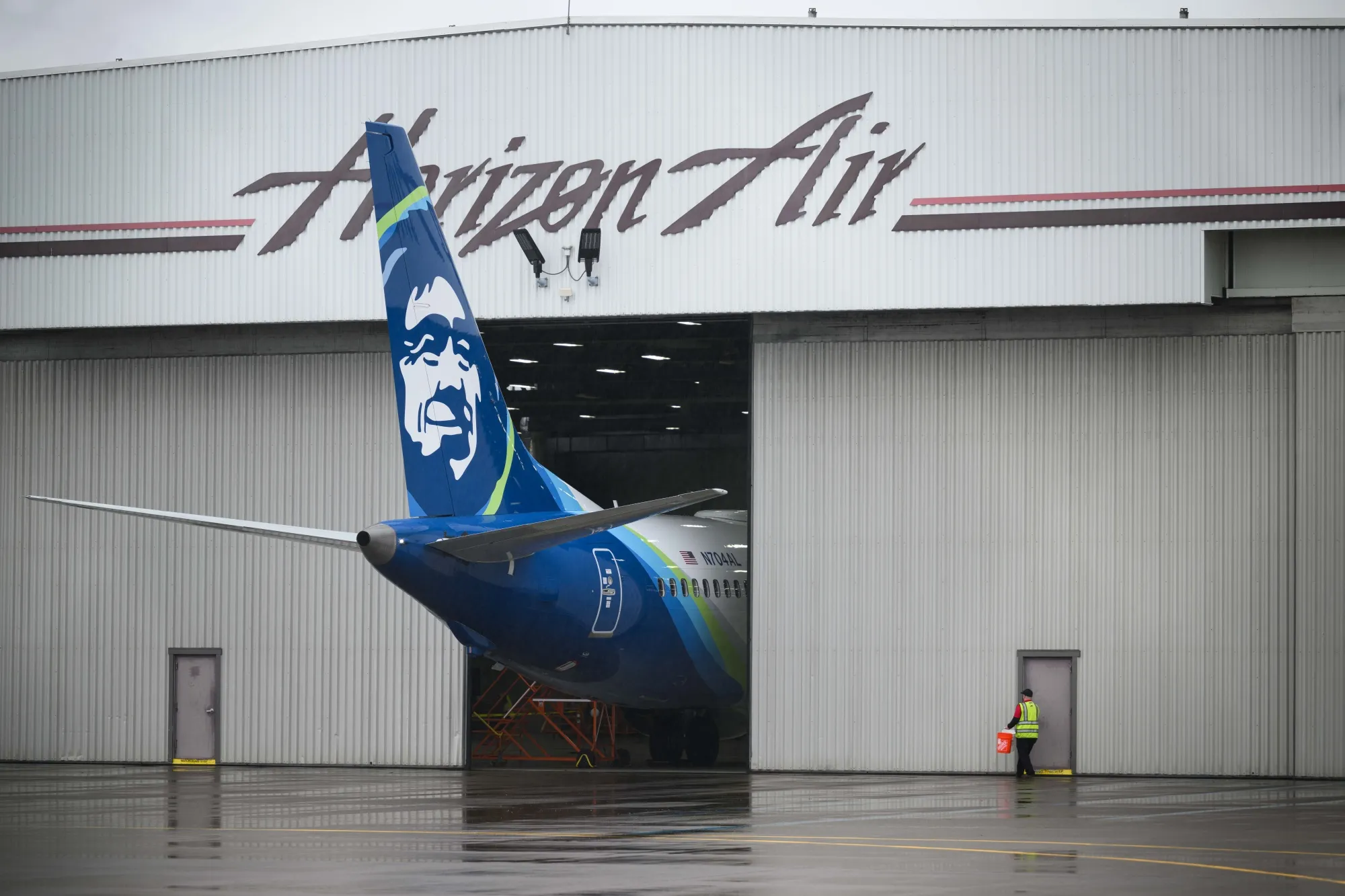 Alaska Airlines N704AL grounded in a hangar at Portland International Airport.&nbsp;