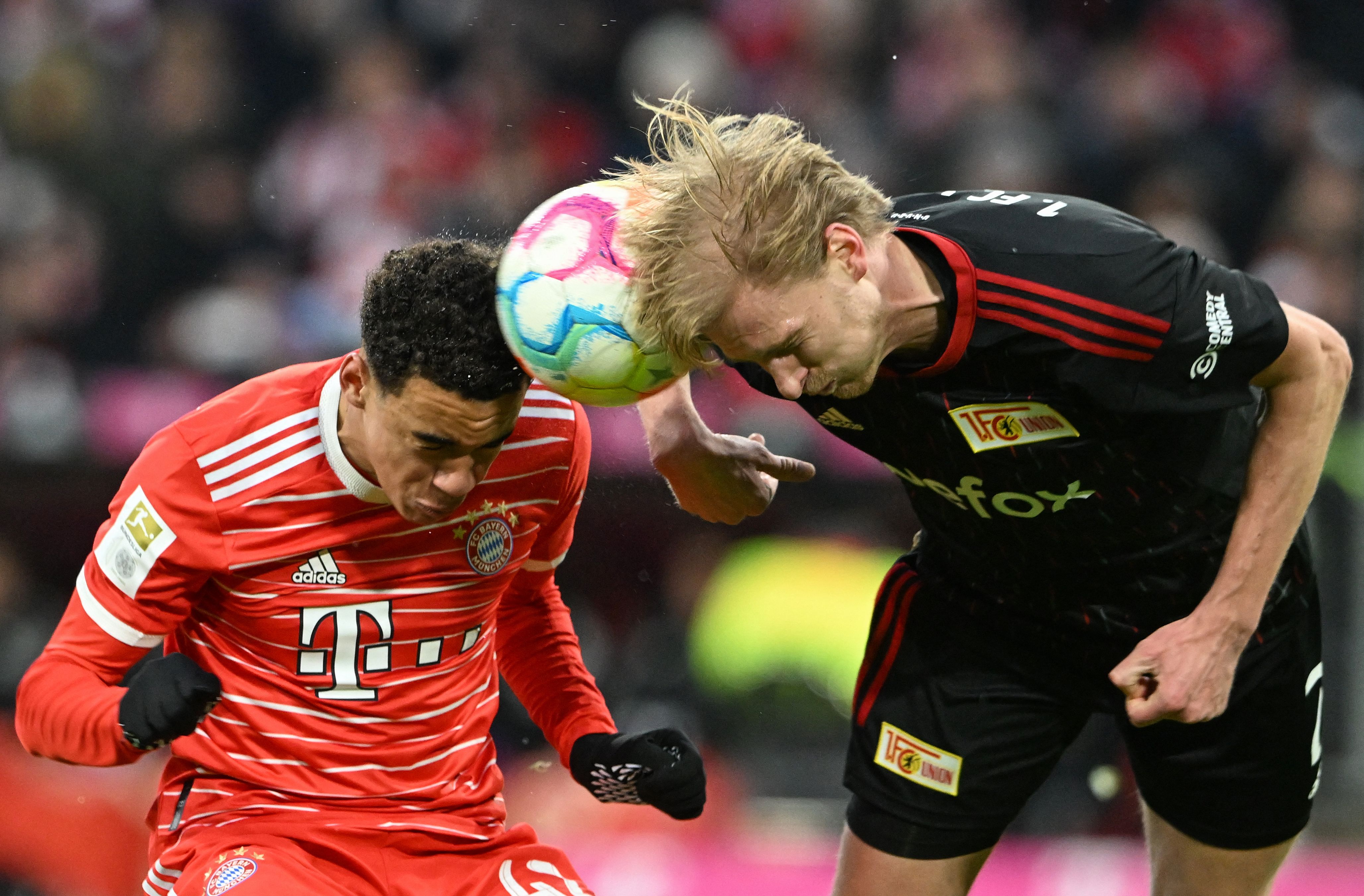 Bayern Munich's German midfielder Jamal Musiala (L) and Union Berlin's Norwegian midfielder Morten Thorsby