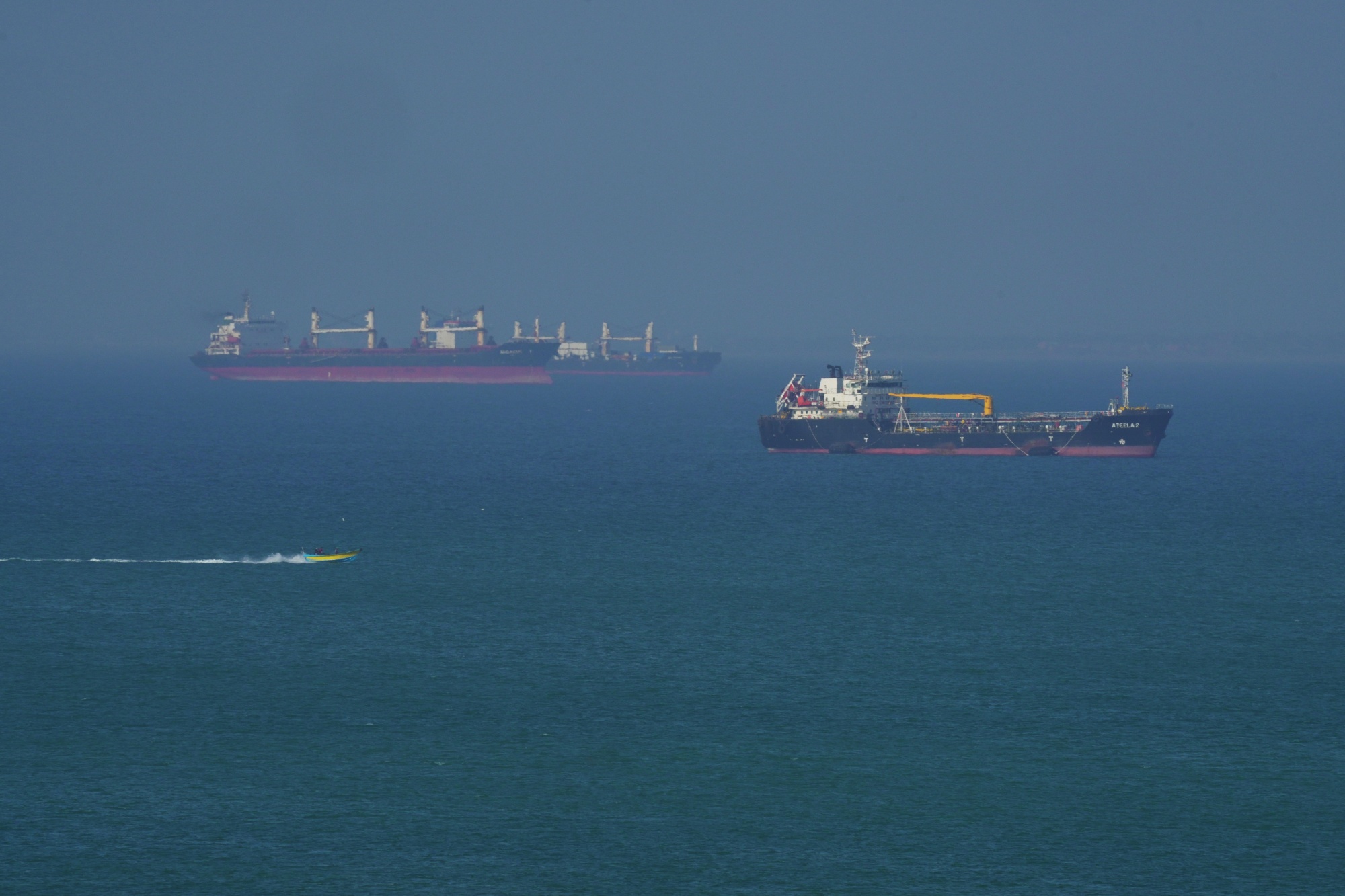 Oil tankers and boats in the Strait of Hormuz in April. Photographer: Asghar Besharati/Getty Images