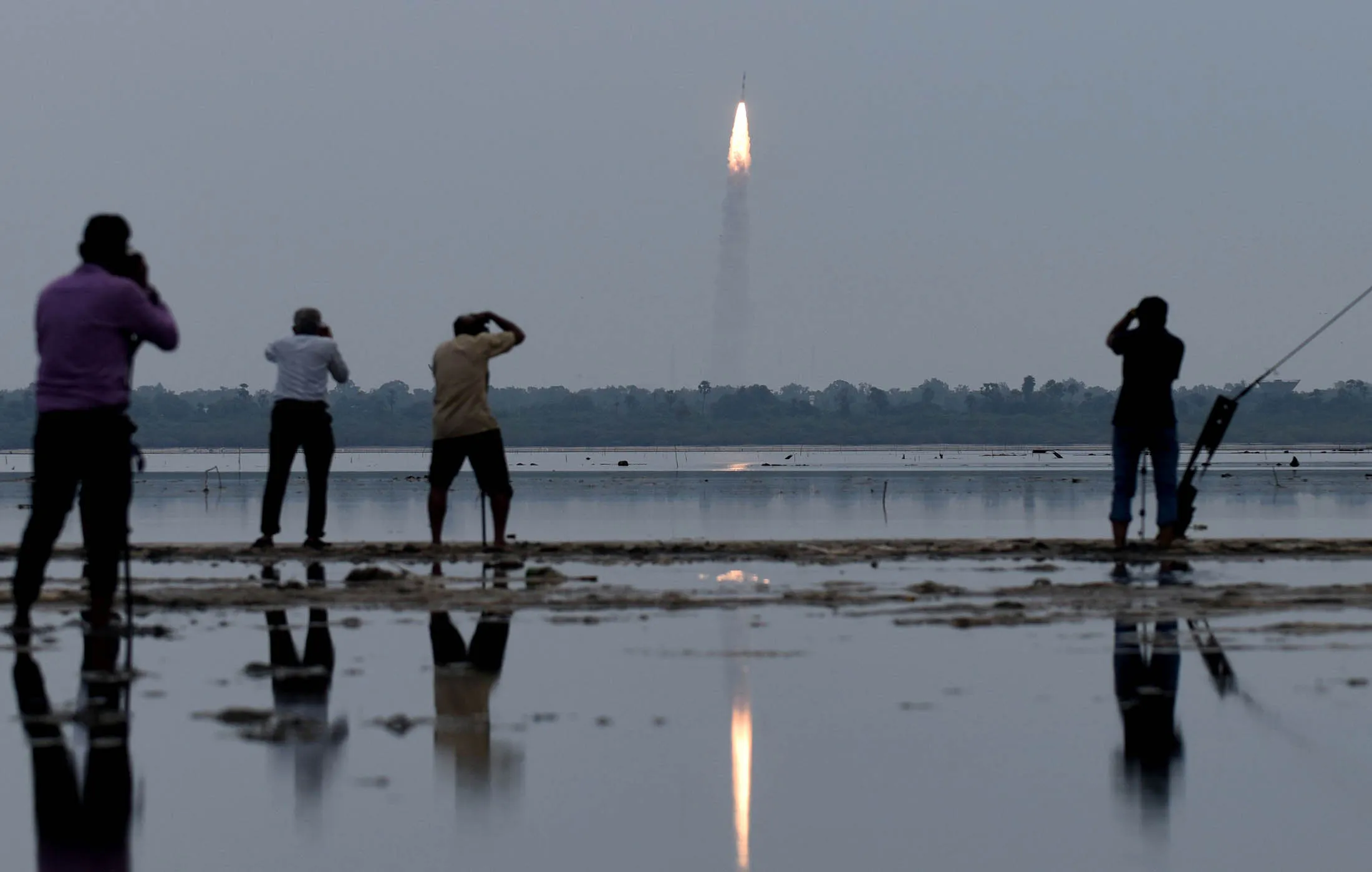 People photograph the launch of the Polar Satellite Launch Vehicle (PSLV-C35) in Andhra Pradesh.