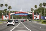 Cars arrive at the Walt Disney World theme park entrance on July 11.
