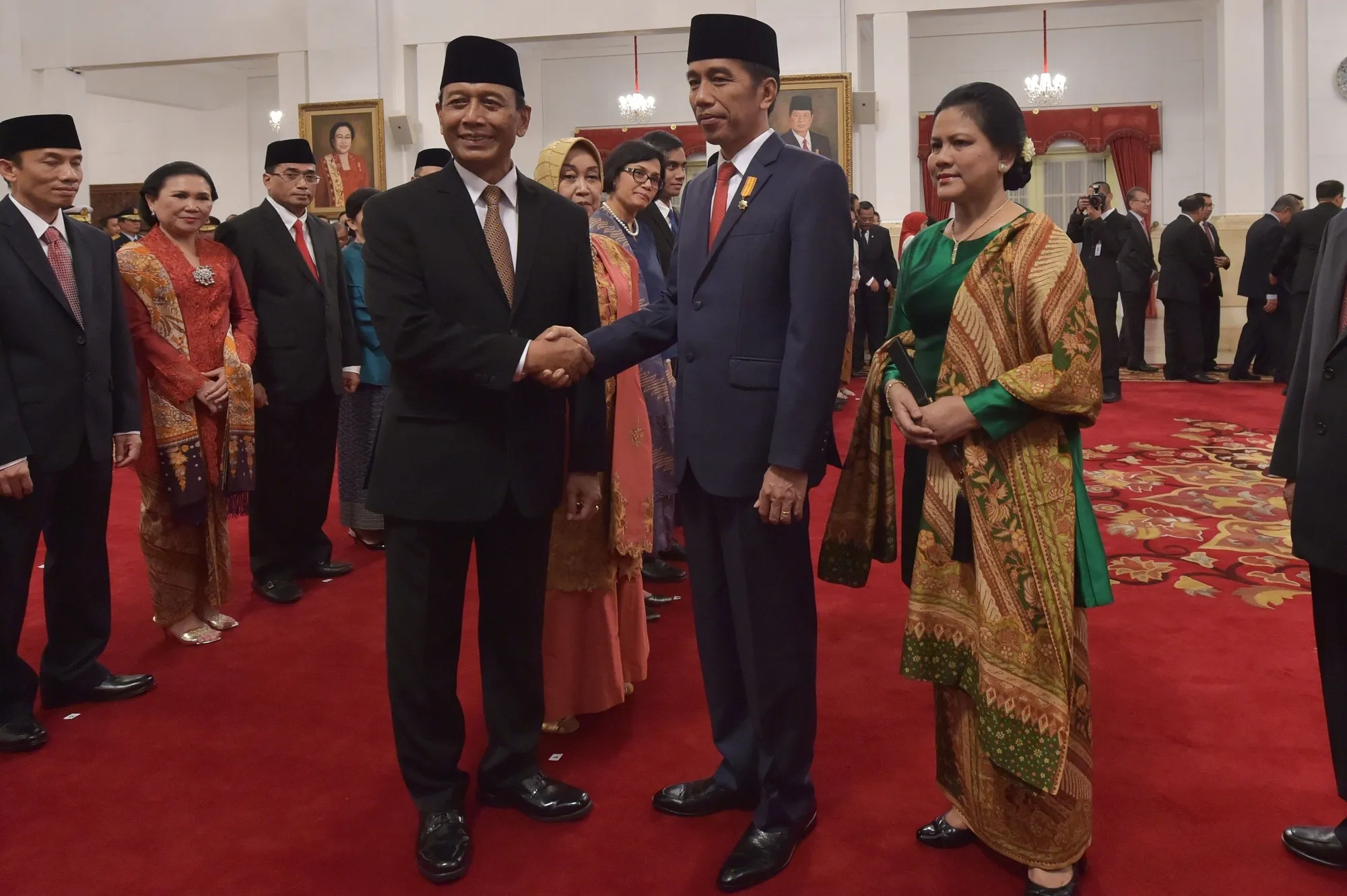 Joko Widodo with newly appointed Wiranto during an inauguration ceremony in Jakarta on July 27.
