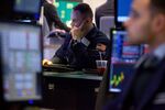 Traders work on the floor of the New York Stock Exchange (NYSE) in New York, U.S., on Monday, Feb. 5, 2018.