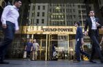 Pedestrians walk past Trump Tower, owned by Trump Organization Inc. Chief Executive Officer and 2016 Republican presidential candidate Donald Trump, in New York, U.S., on Wednesday, Aug. 26, 2015. Trump told Bloomberg Television that he agrees the carried interest tax 'loophole' should be eliminated and that it is a 'tremendous burden' on the country's finances.
