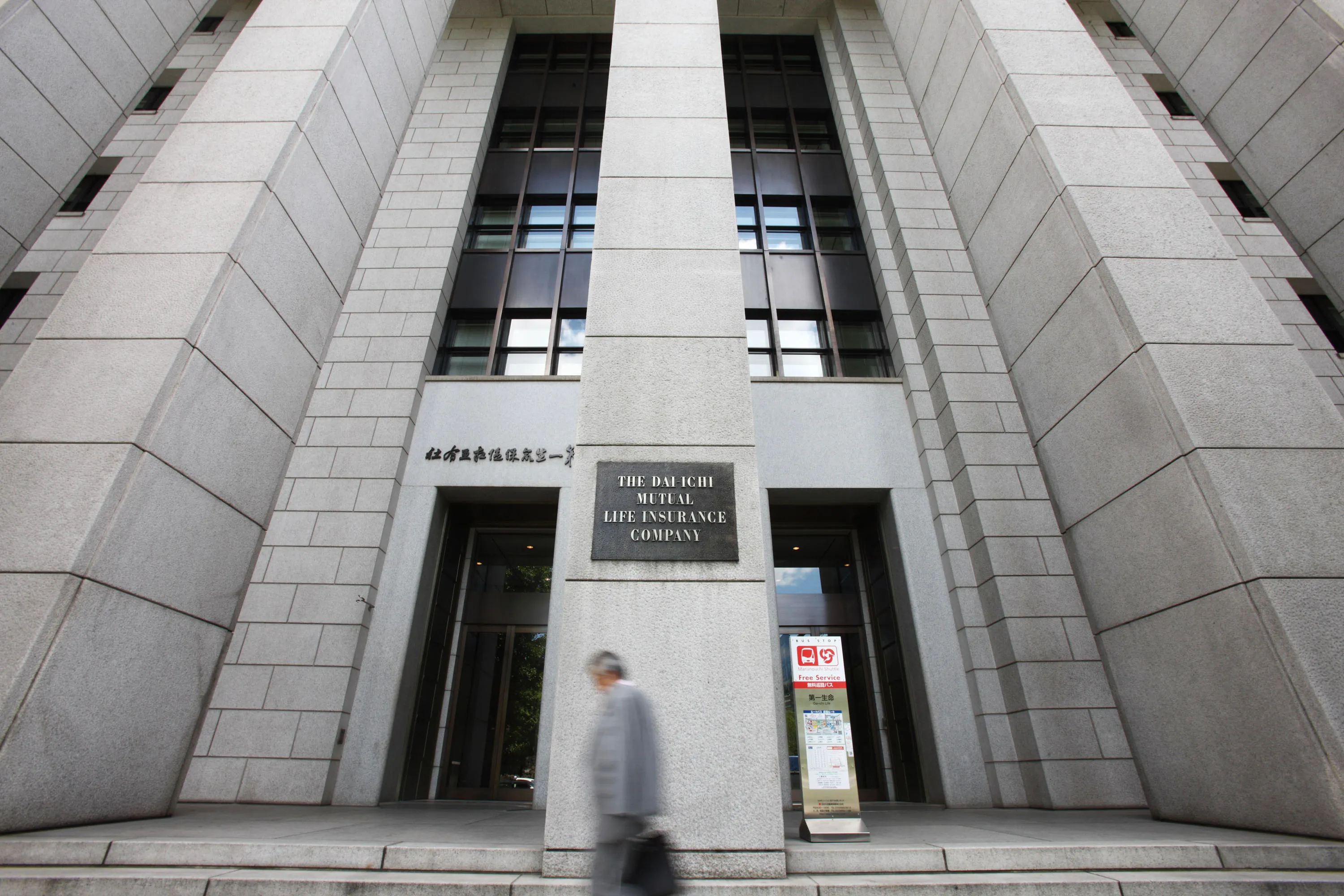 A man walks past the Dai-ichi&nbsp;headquarters in Tokyo.