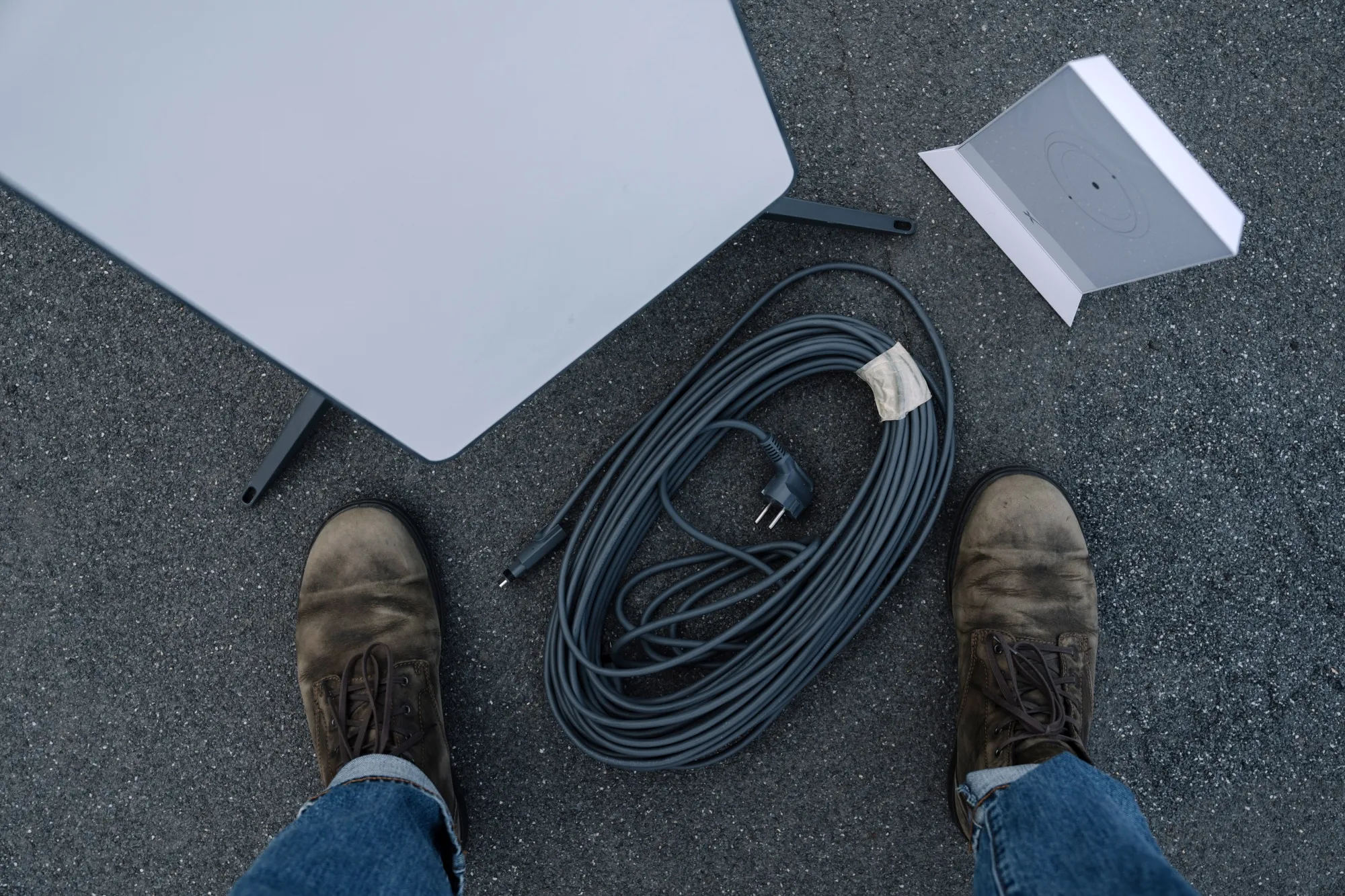 A Starlink satellite-internet communication system antenna and router.