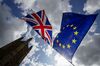 Anti-Brexit Demonstrators wave the British Union flag and the European Union (EU) flag outside the Houses of Parliament in London, U.K., on Wednesday, Sept. 4, 2019. U.K. Prime Minister Boris Johnson suffered an historic defeat in Parliament and the showdown over Brexit continues today in the House of Commons.