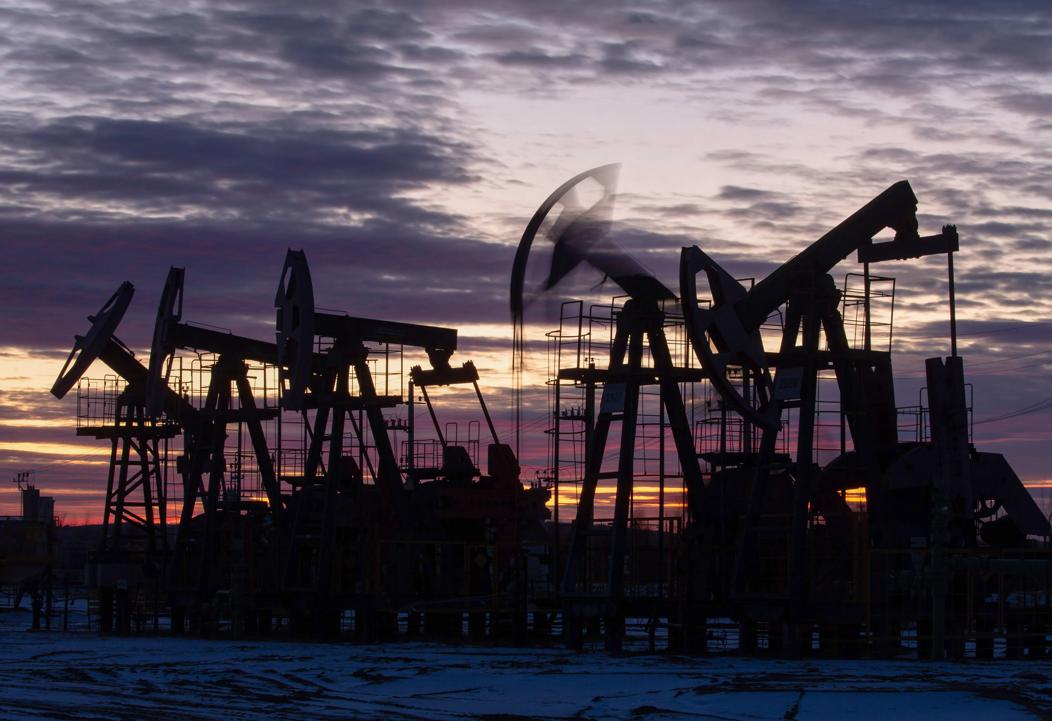 Oil pumping jacks at sunset.