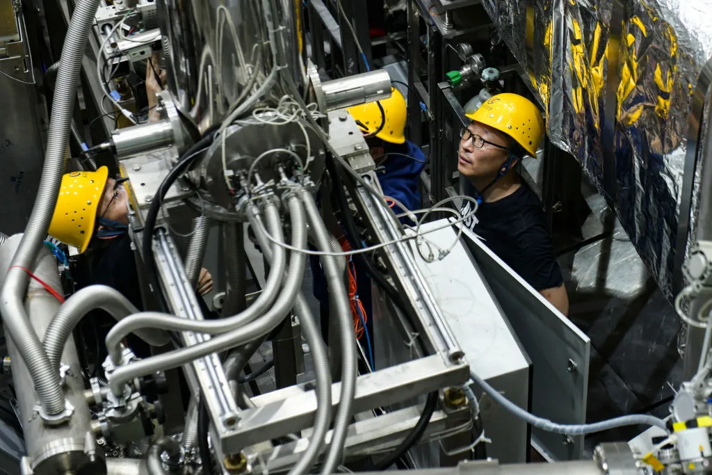 A technician debugs an experimental superconductor.
