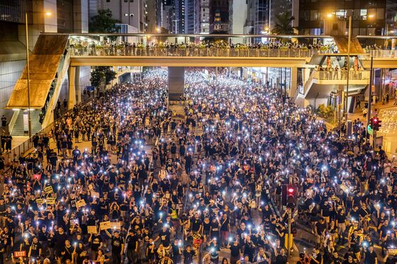 Riot Police Fire Tear Gas to Clear Protesters in Hong Kong