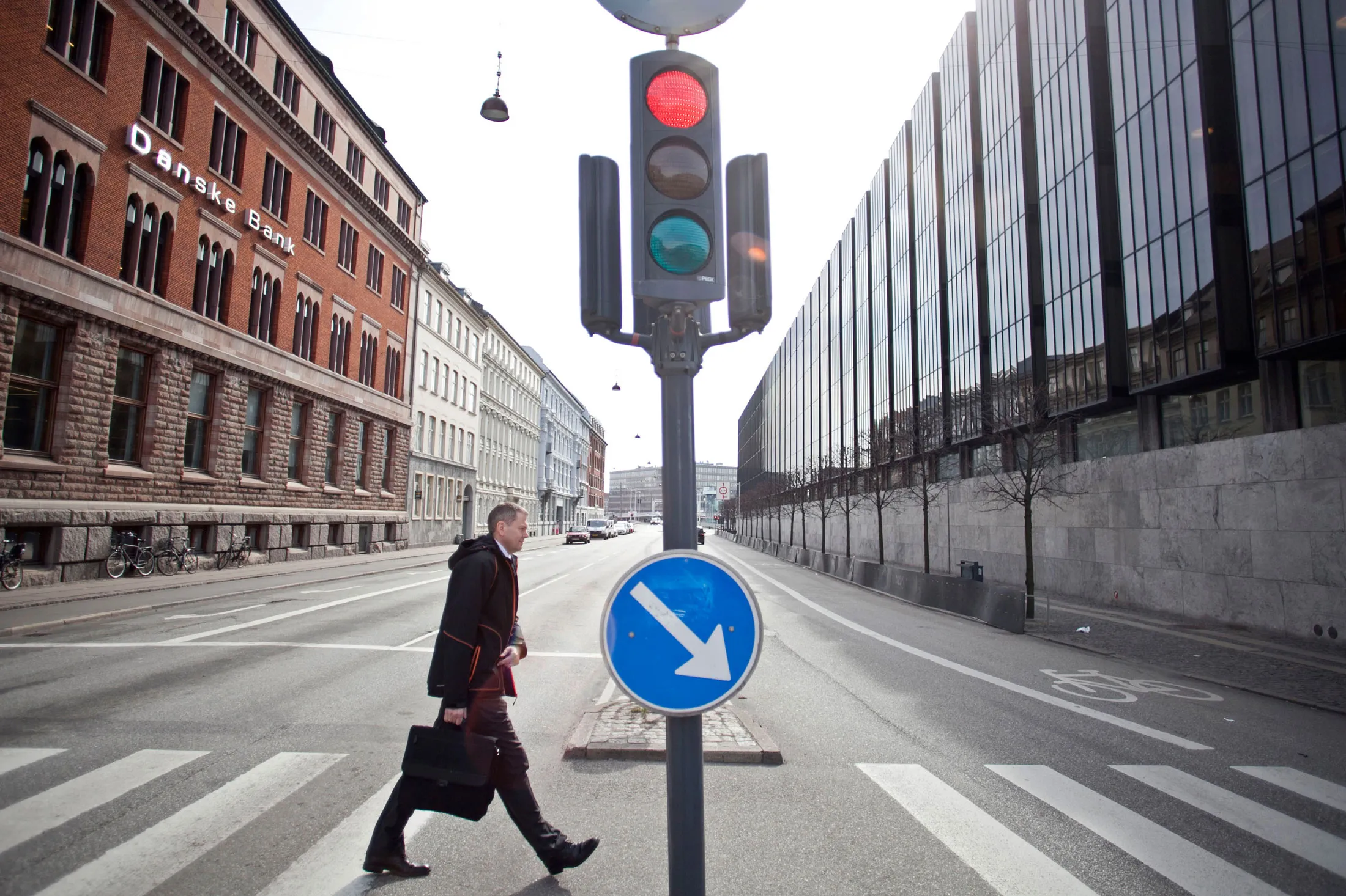 The headquarters of Danske Bank, left, stands opposite the Danish central bank in Copenhagen.
