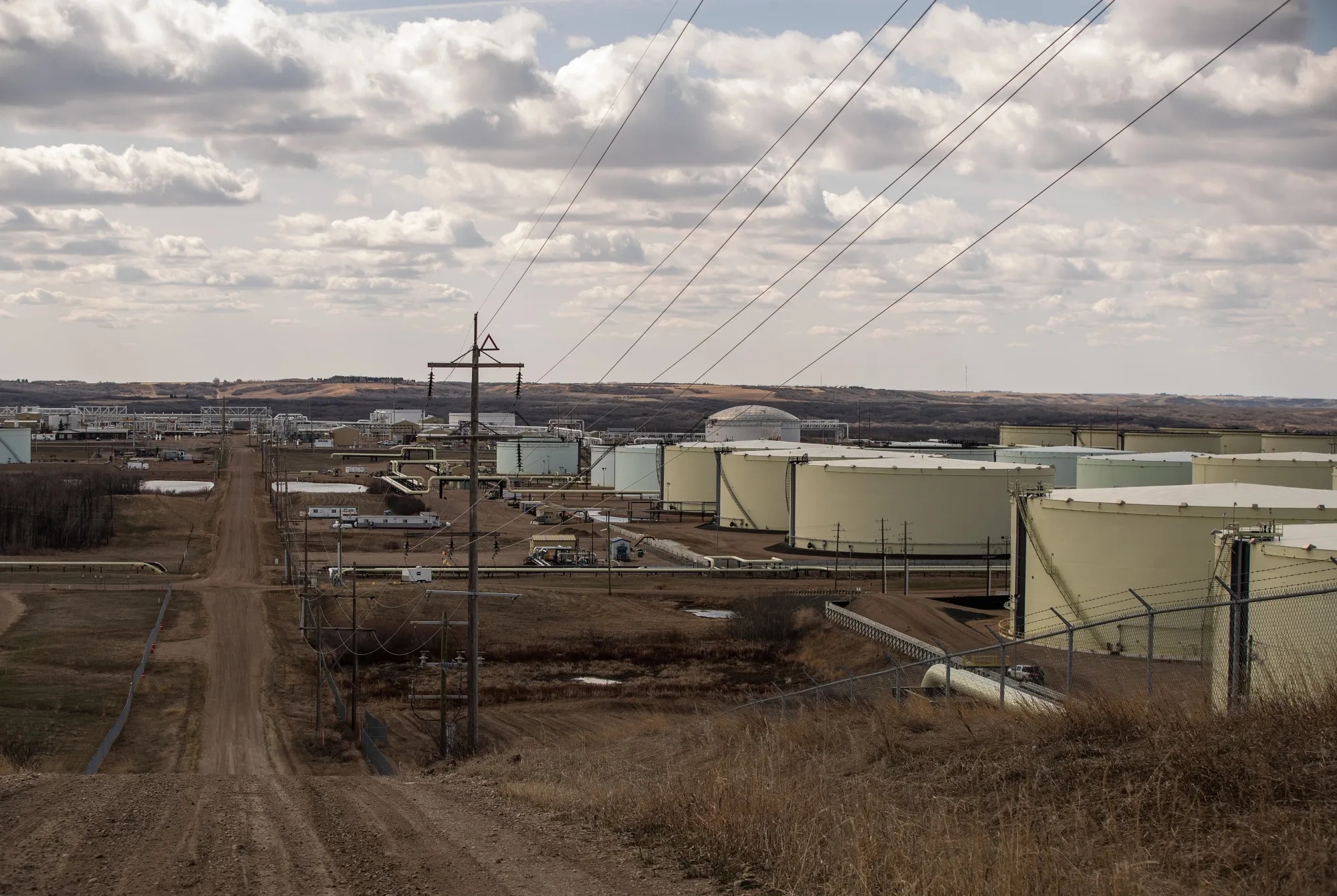 Oil storage containers and pipelines at an oil terminal in Hardisty, Alberta.