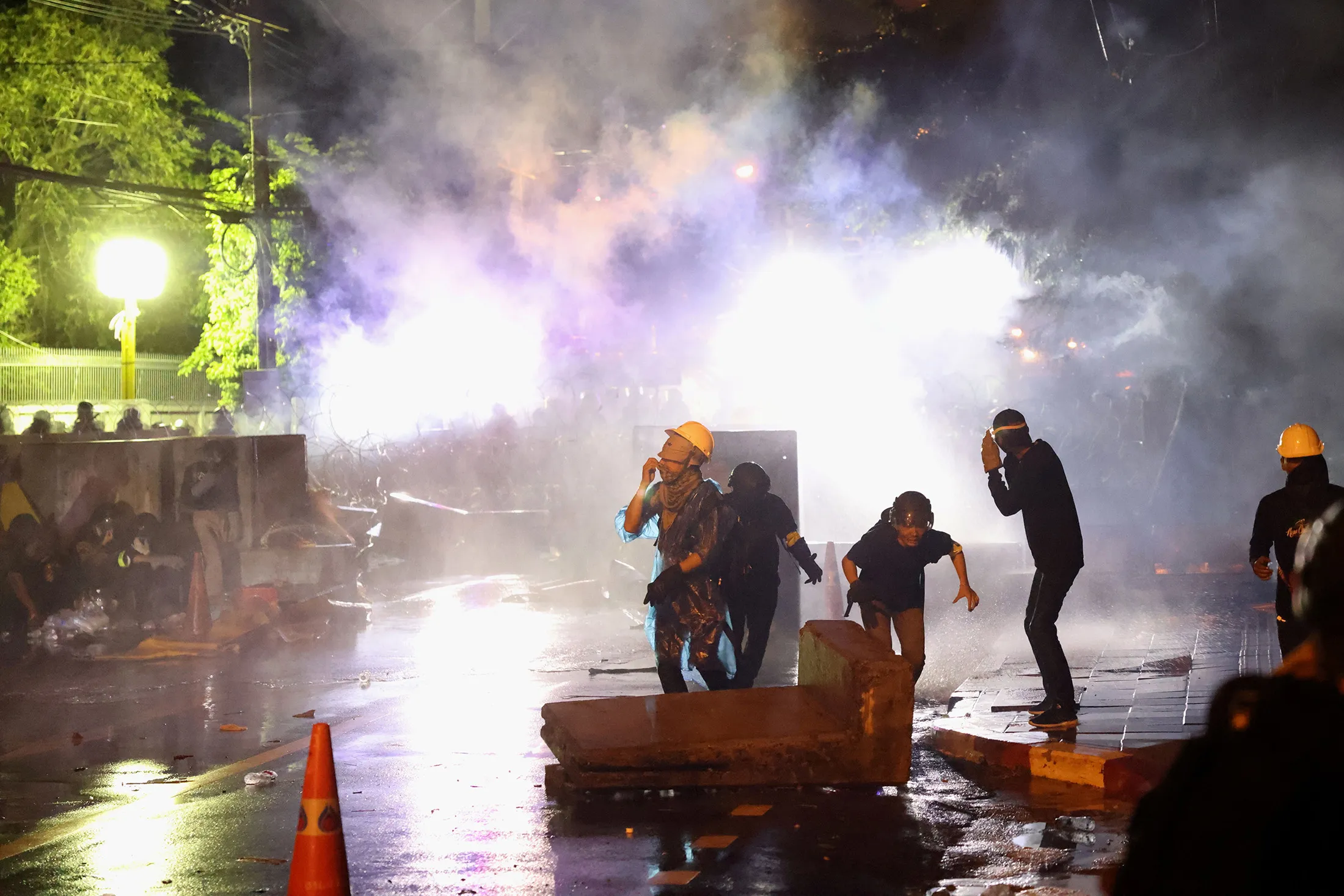 Police fired tear gas during a rally near the Thai Parliament in Bangkok on Tuesday.