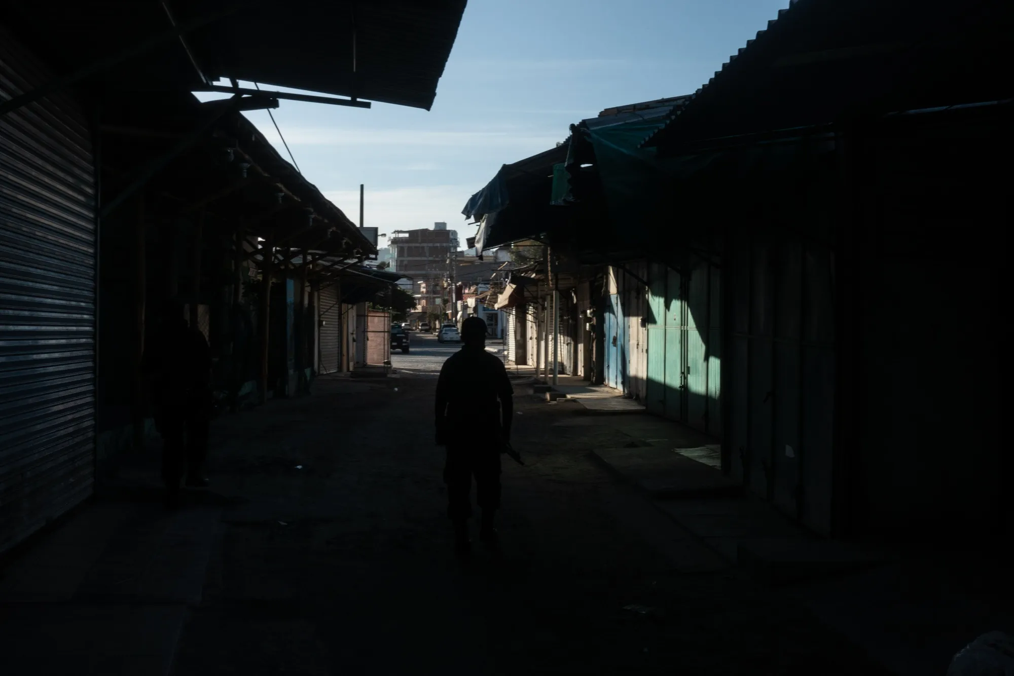 A police officer patrols a closed market in the town of Bucerias, Mexico, on April 23.
