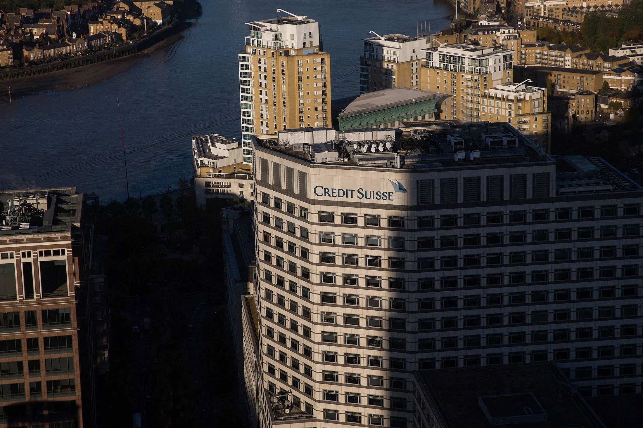 A Credit Suisse logo sits on their offices in London, U.K., on Wednesday, Oct. 14, 2015. Britain's inflation rate turned negative for only the second time since 1960 in September, reflecting weak price pressures that the Bank of England has warned will persist into 2016.
