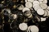 Canadian one dollar coins, also known as Loonies, sit in a pile at the Royal Canadian Mint.