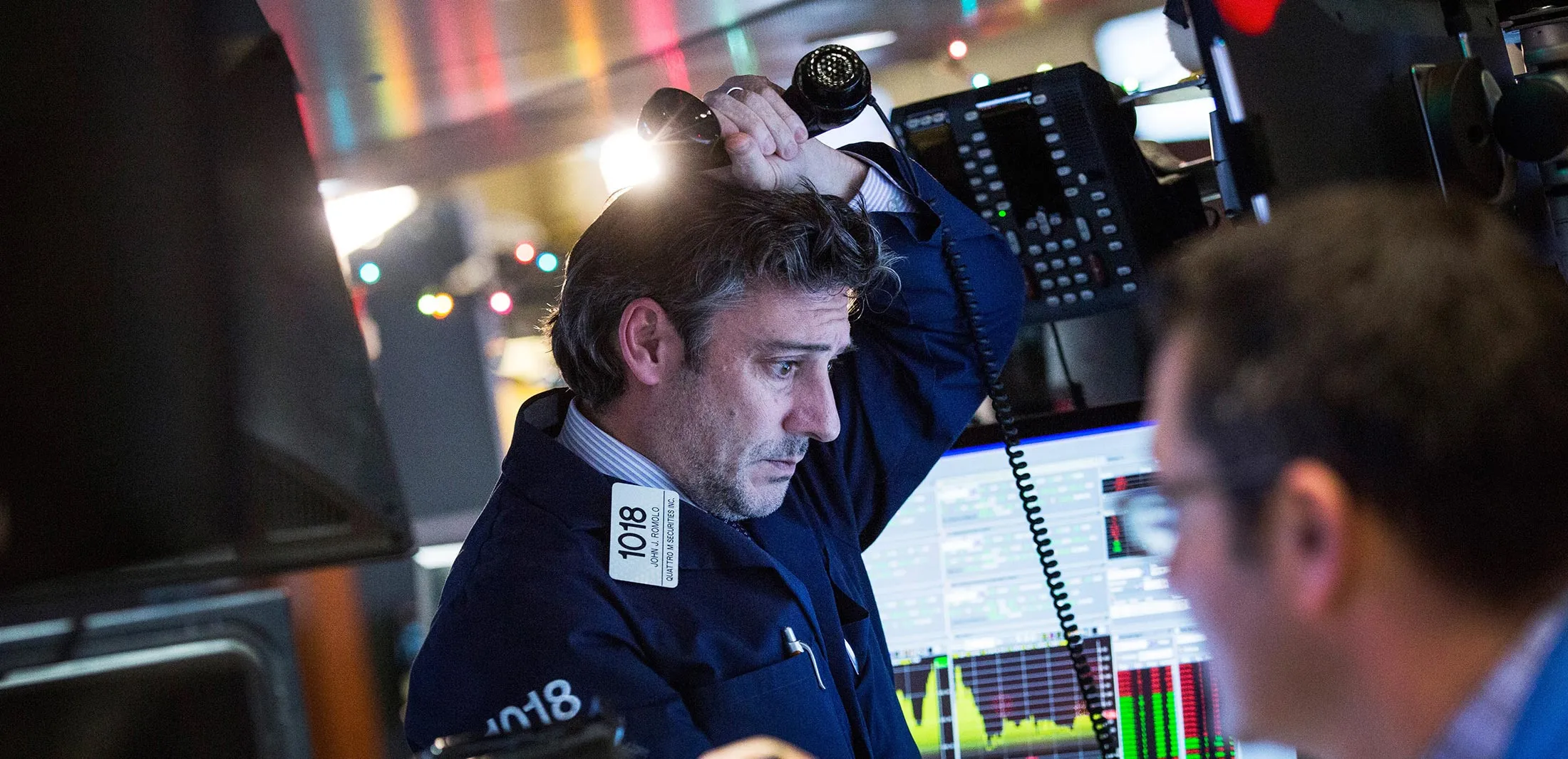 A trader works on the floor of the New York Stock Exchange during the afternoon of January 4, 2016 in New York City.
