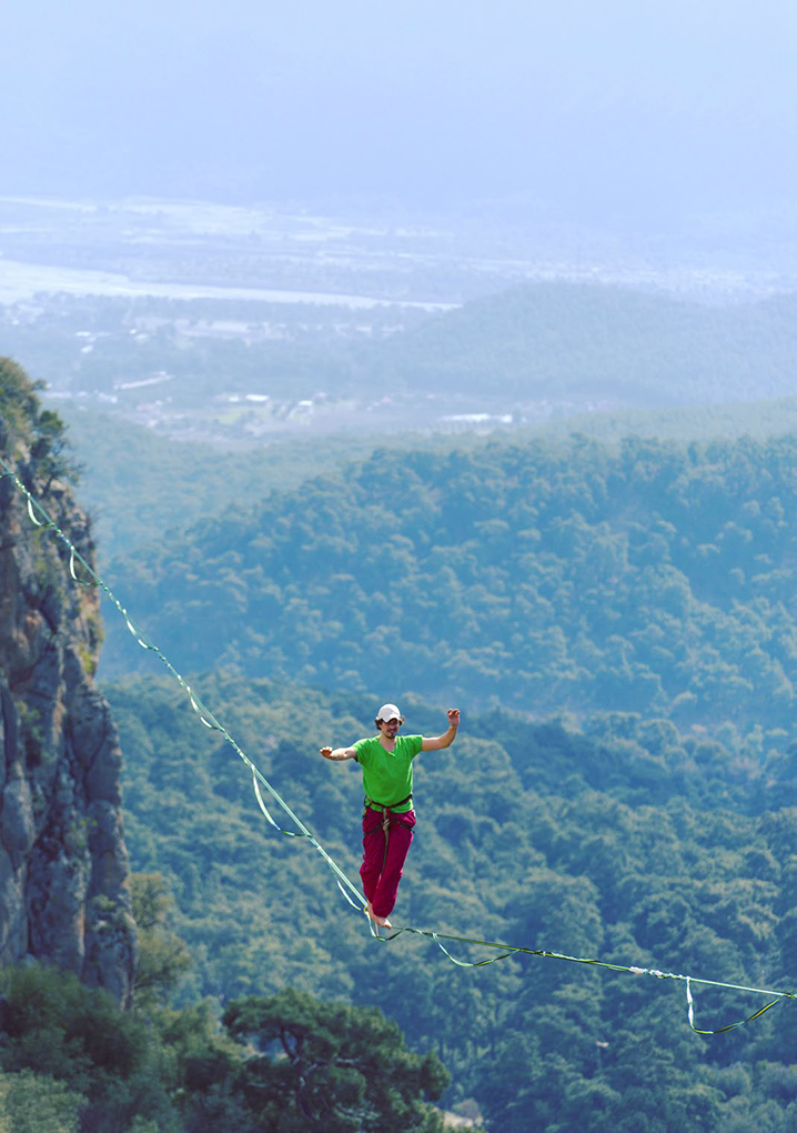 tightrope walker in the mountains