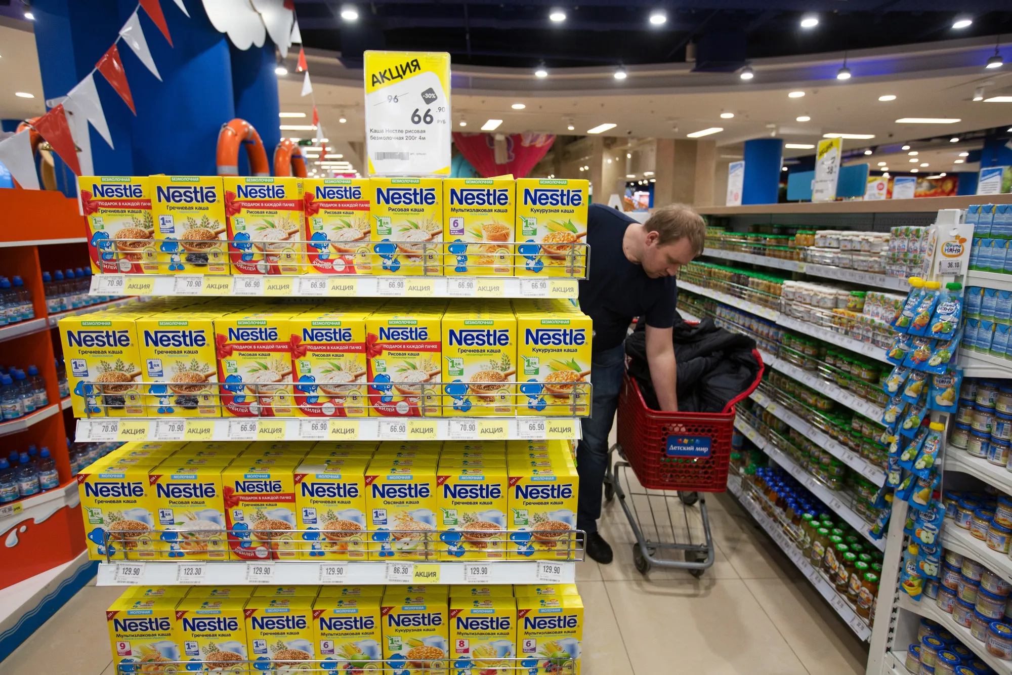 Food products manufactured by Nestle SA sit on display near baby food products inside a store&nbsp;in Moscow, Russia.