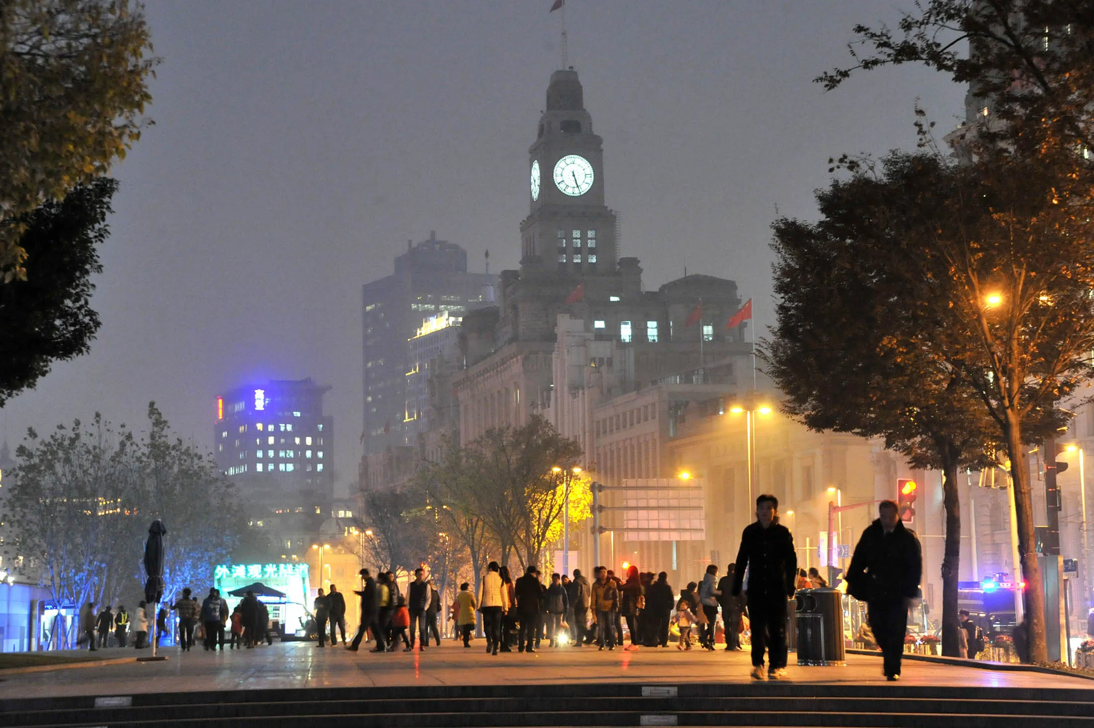 Tourists walk on the Bund in Shanghai during heavy smog on Dec. 14.
