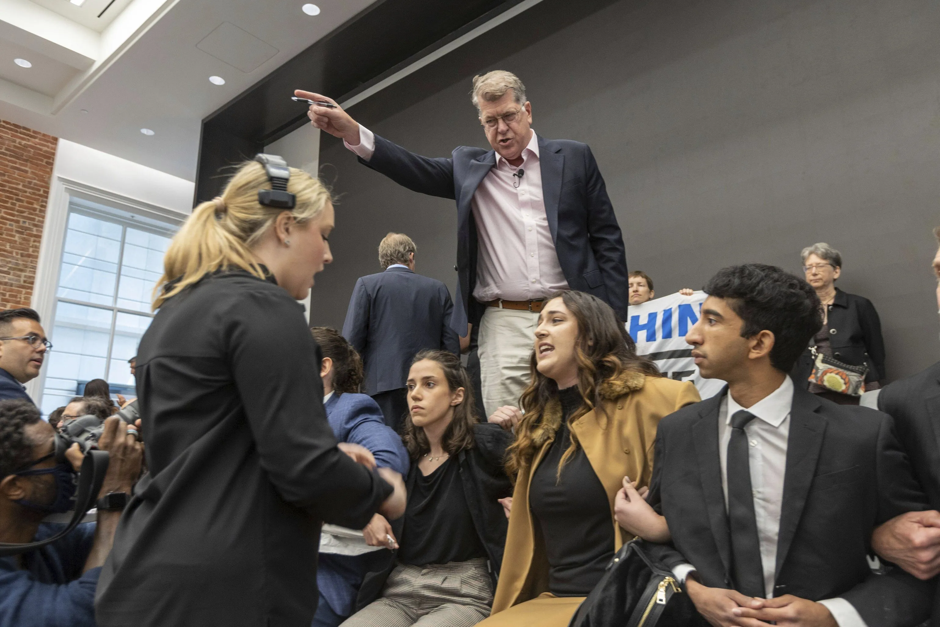 Steve Clemons yells at protestors to get off the stage during an appearance by Joe Manchin&nbsp;in Washington DC on June 6.&nbsp;
