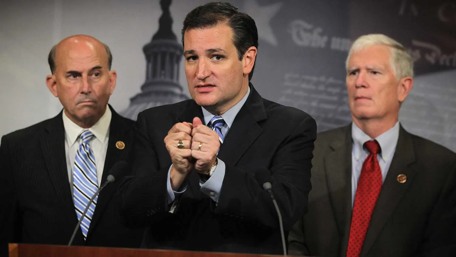 U.S. Sen. Ted Cruz (R-TX) (2nd L) speaks as Rep. Mo Brooks (R-AL) (R) and Rep. Louie Gohmert (R-TX) (L) listen during a news conference September 9, 2014 on Capitol Hill in Washington, DC.
