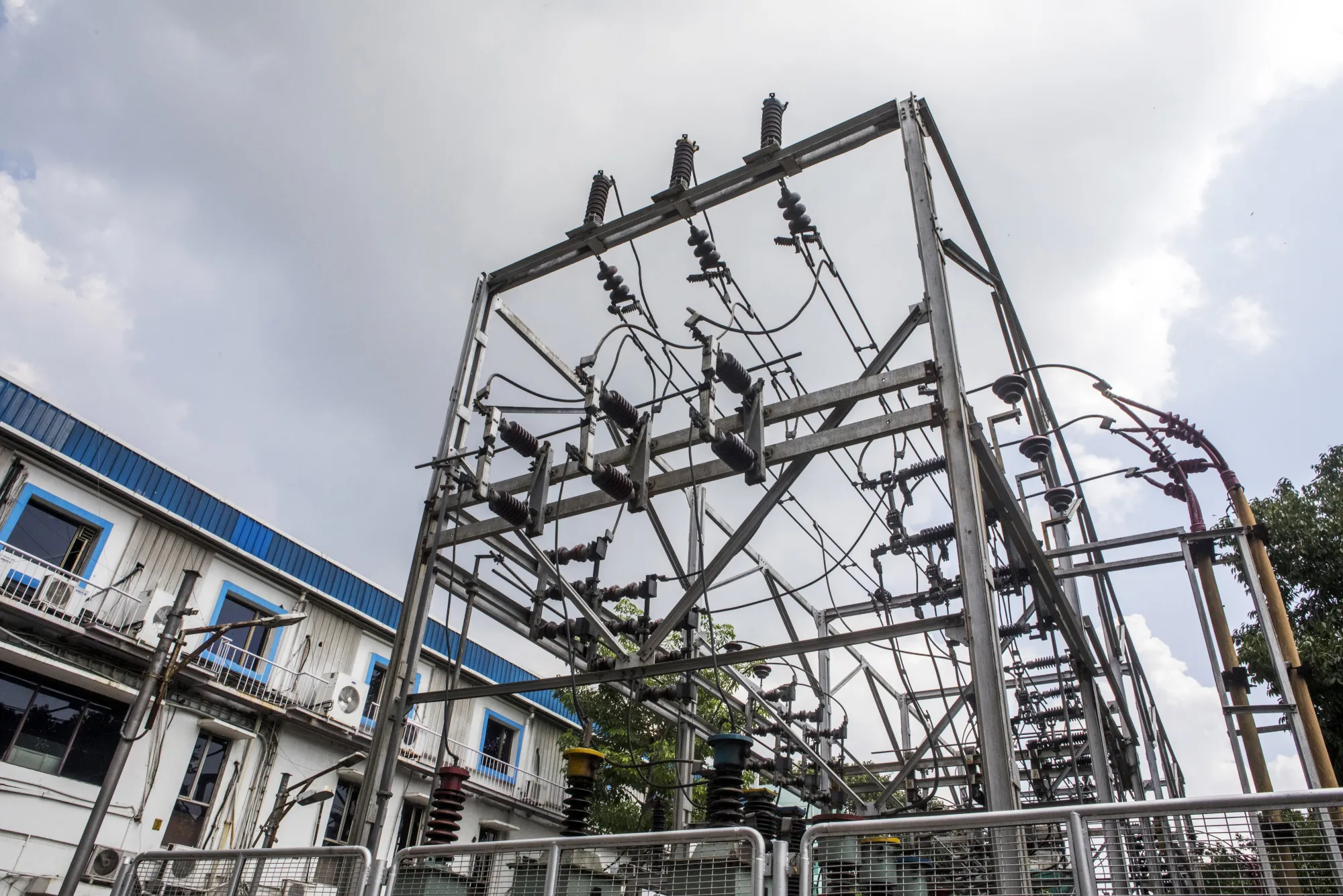 An electrical substation stands outside a Tata Power Delhi Distribution Ltd. office in New Delhi.