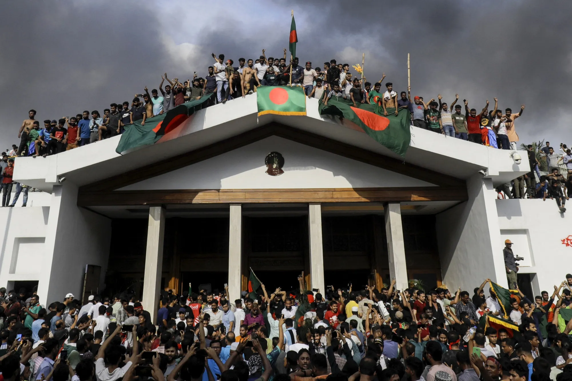 Anti-government protestors storm Sheikh Hasina's palace in Dhaka on Aug. 5.