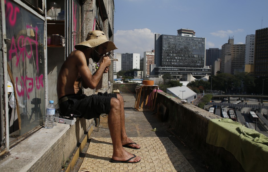 A squatter sits in an abandoned office building in the center of Sao Paulo.