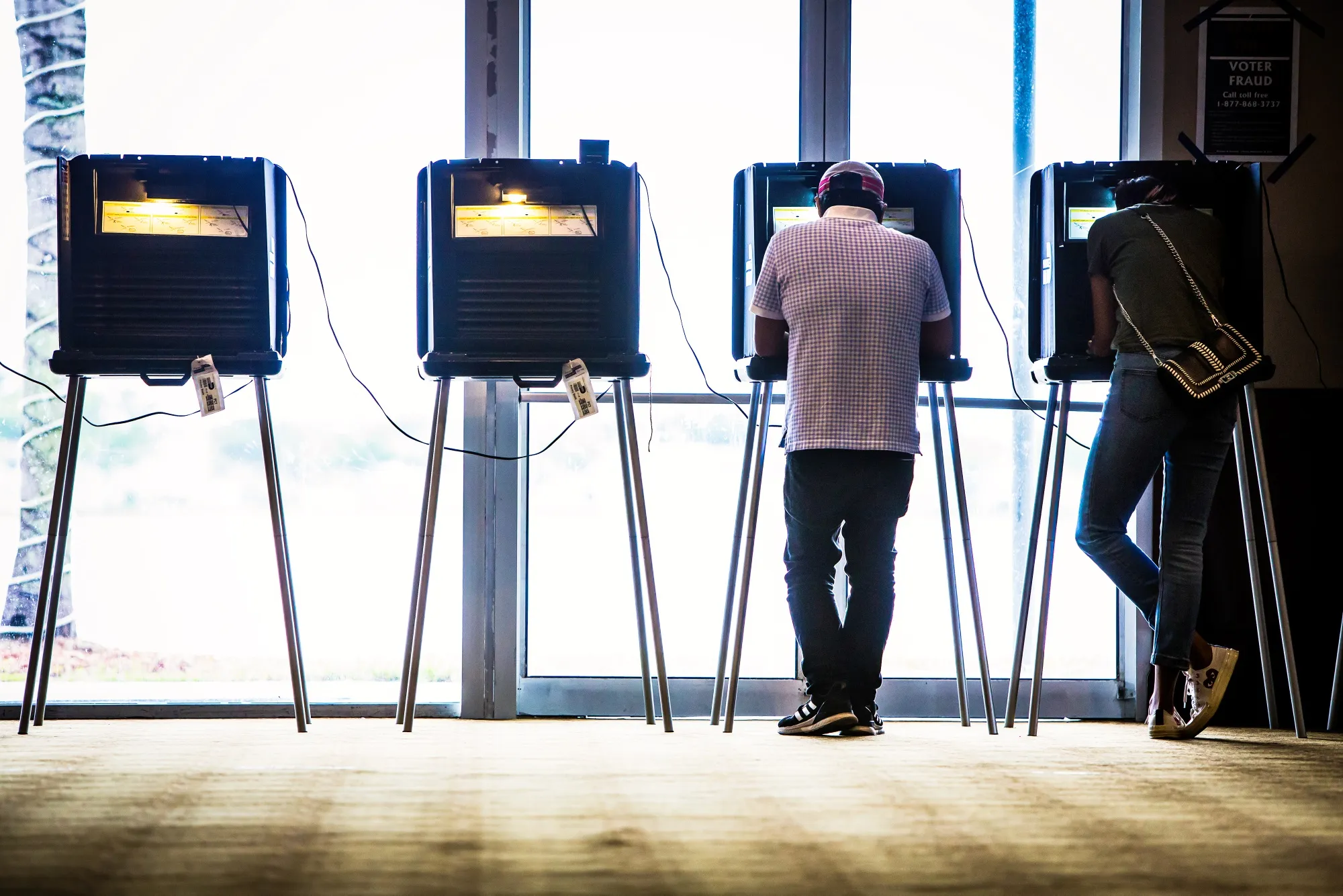 Voters cast ballots at a polling station.
