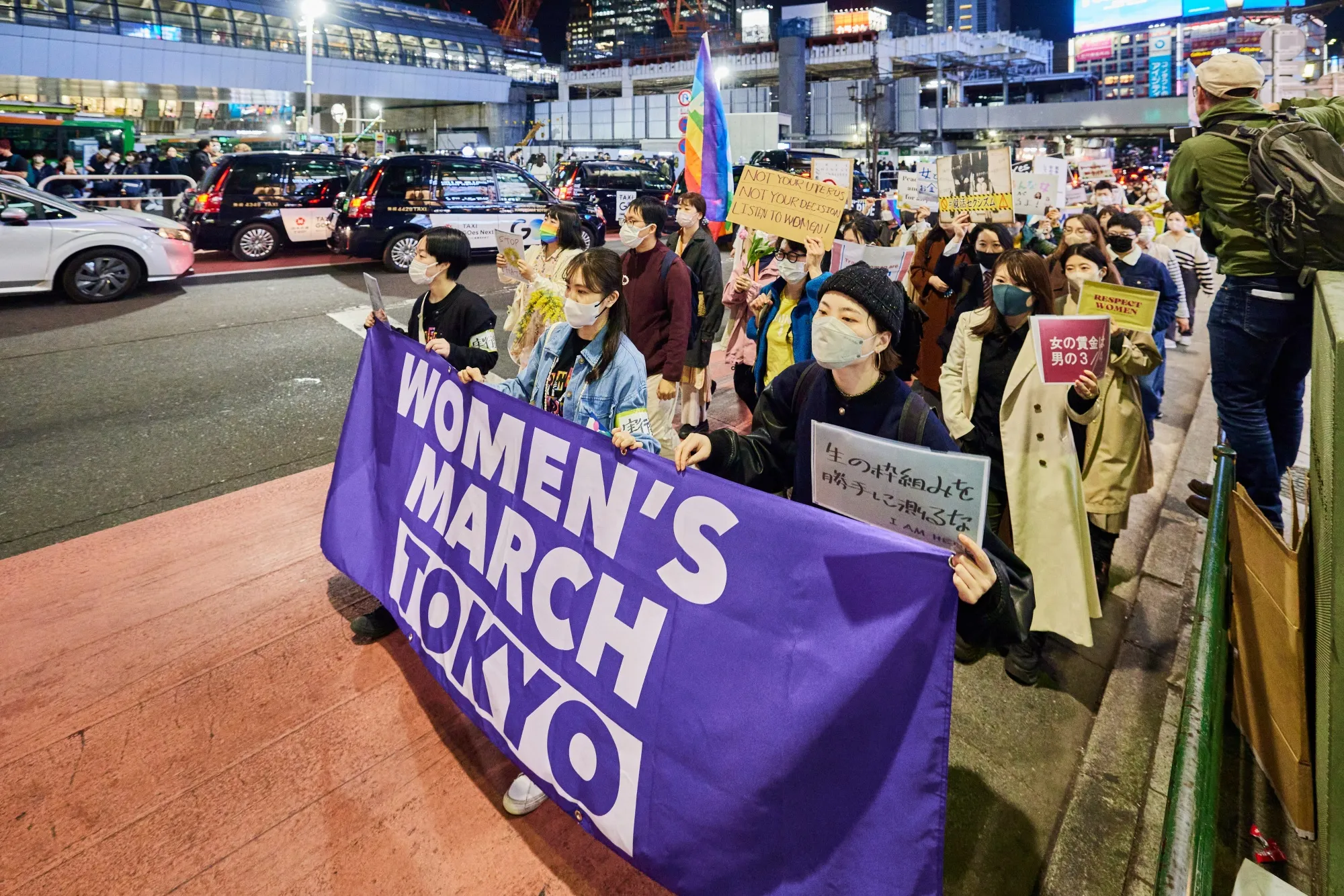 Demonstrators hold a banner during the Women's Day march in Tokyo, Japan, on Wednesday, March 8, 2023.