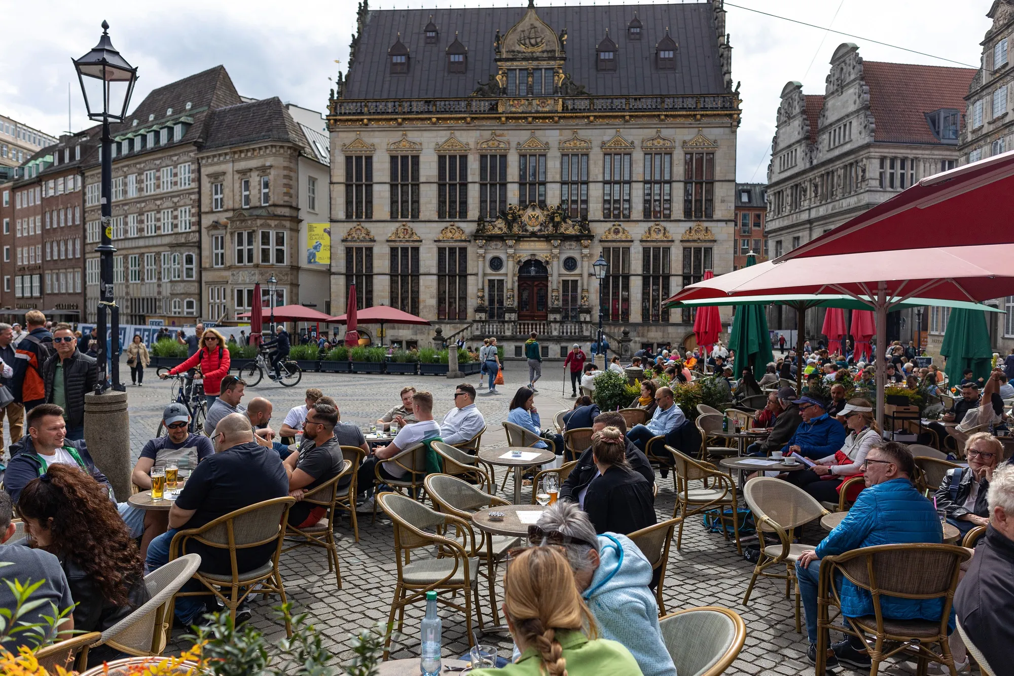 Customers at a restaurant terrace in Bremen, Germany.