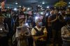 Demonstrators hold placards and the American flag during a rally in support of the Hong Kong Human Rights and Democracy Act in Hong Kong.