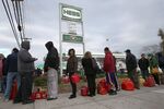 Staten Island residents stand in line for fuel at a gas station